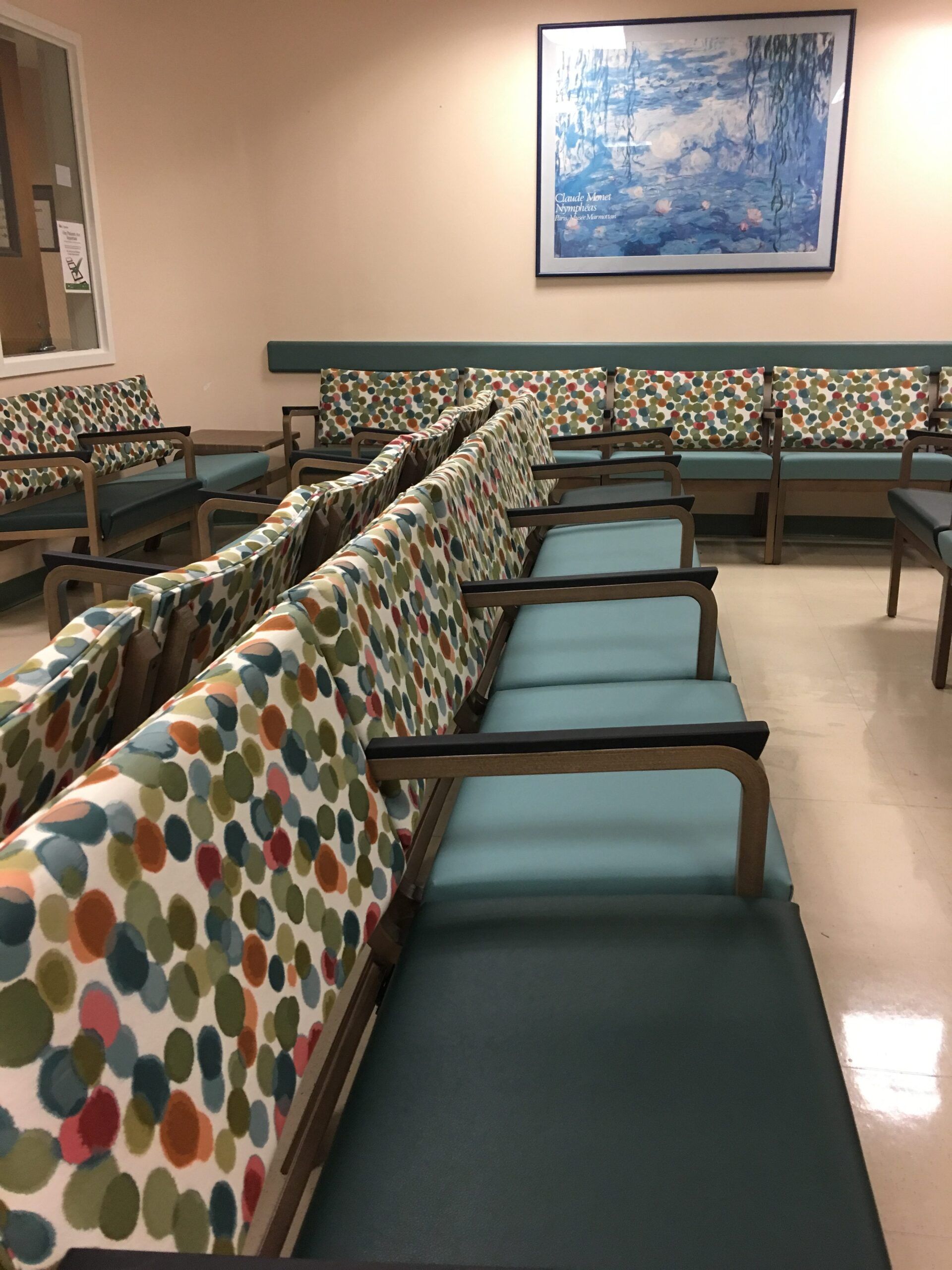 A row of colorful chairs in a waiting room