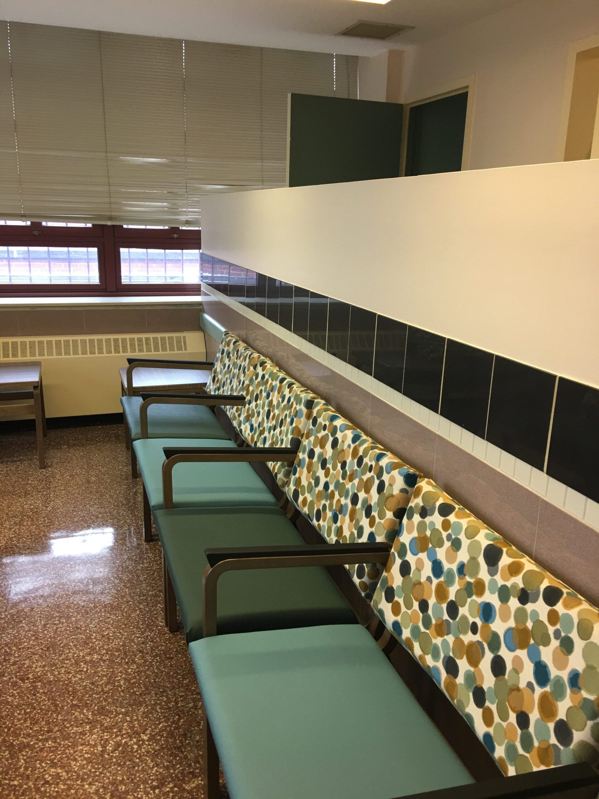 A row of colorful chairs in a waiting room
