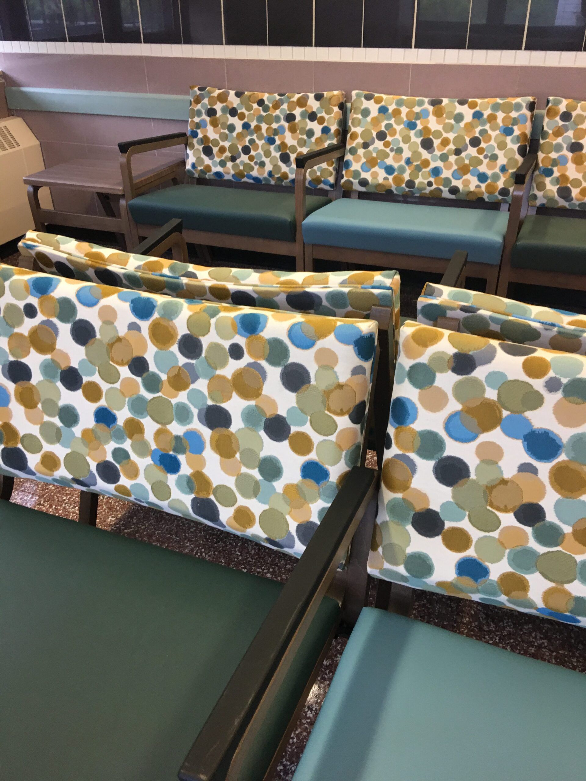 A row of chairs with polka dots on them
