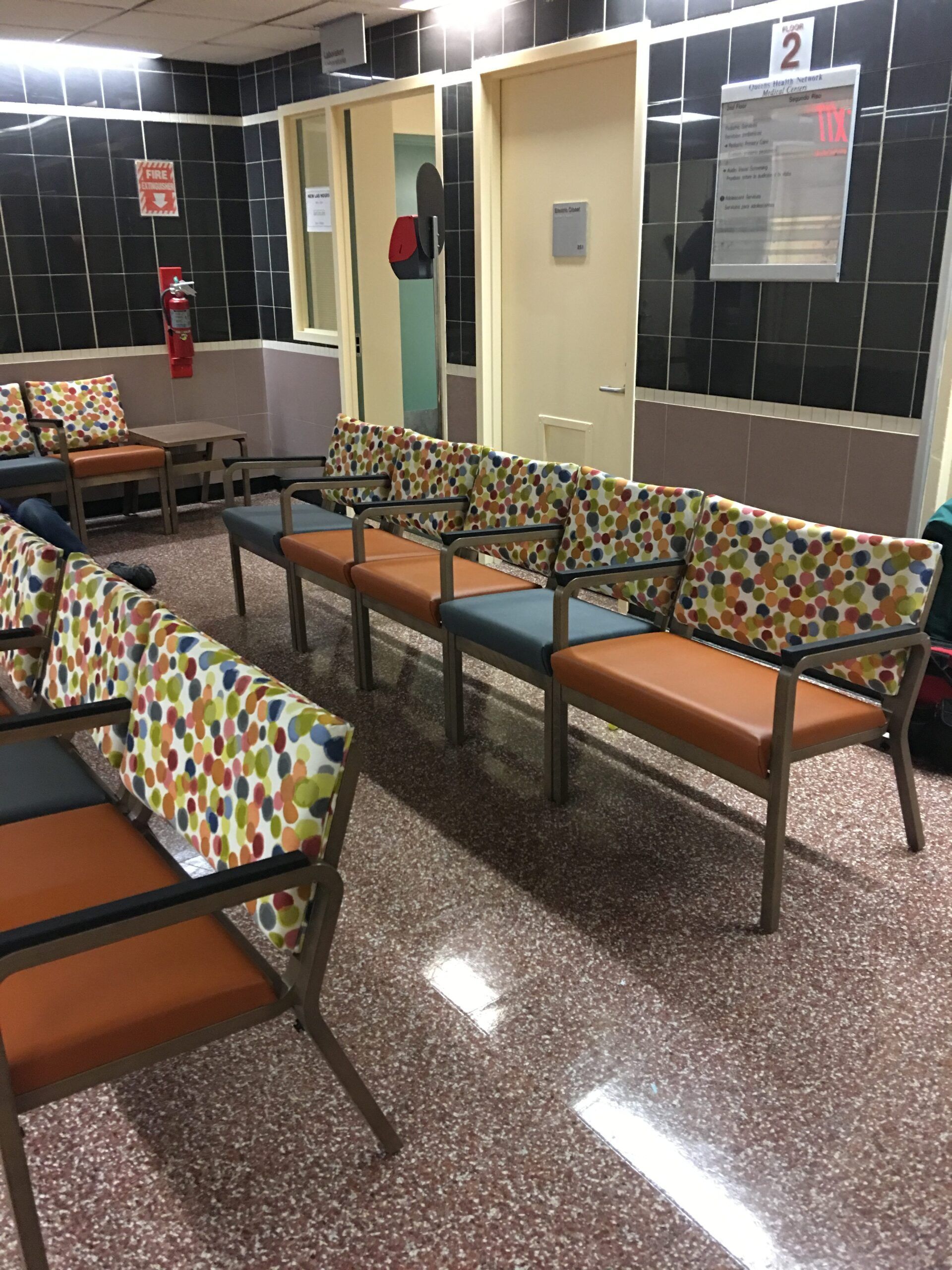 A waiting room with a number 2 on the wall