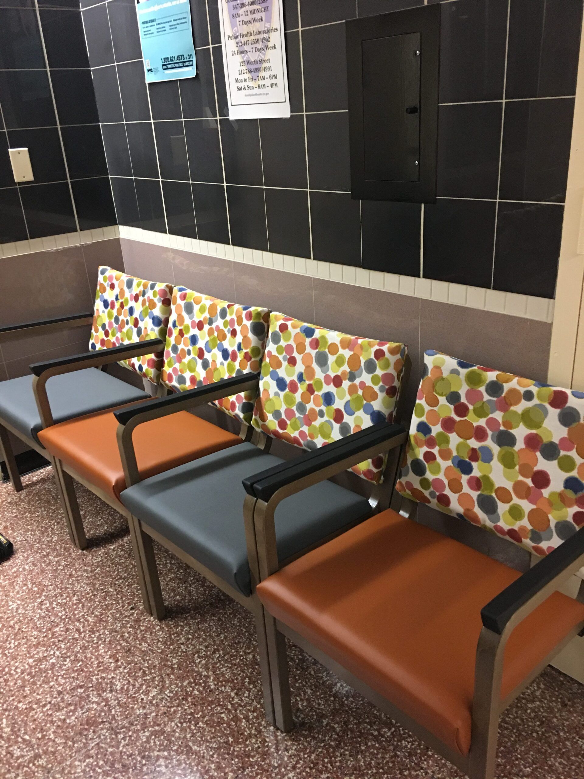 A row of colorful chairs in a waiting room