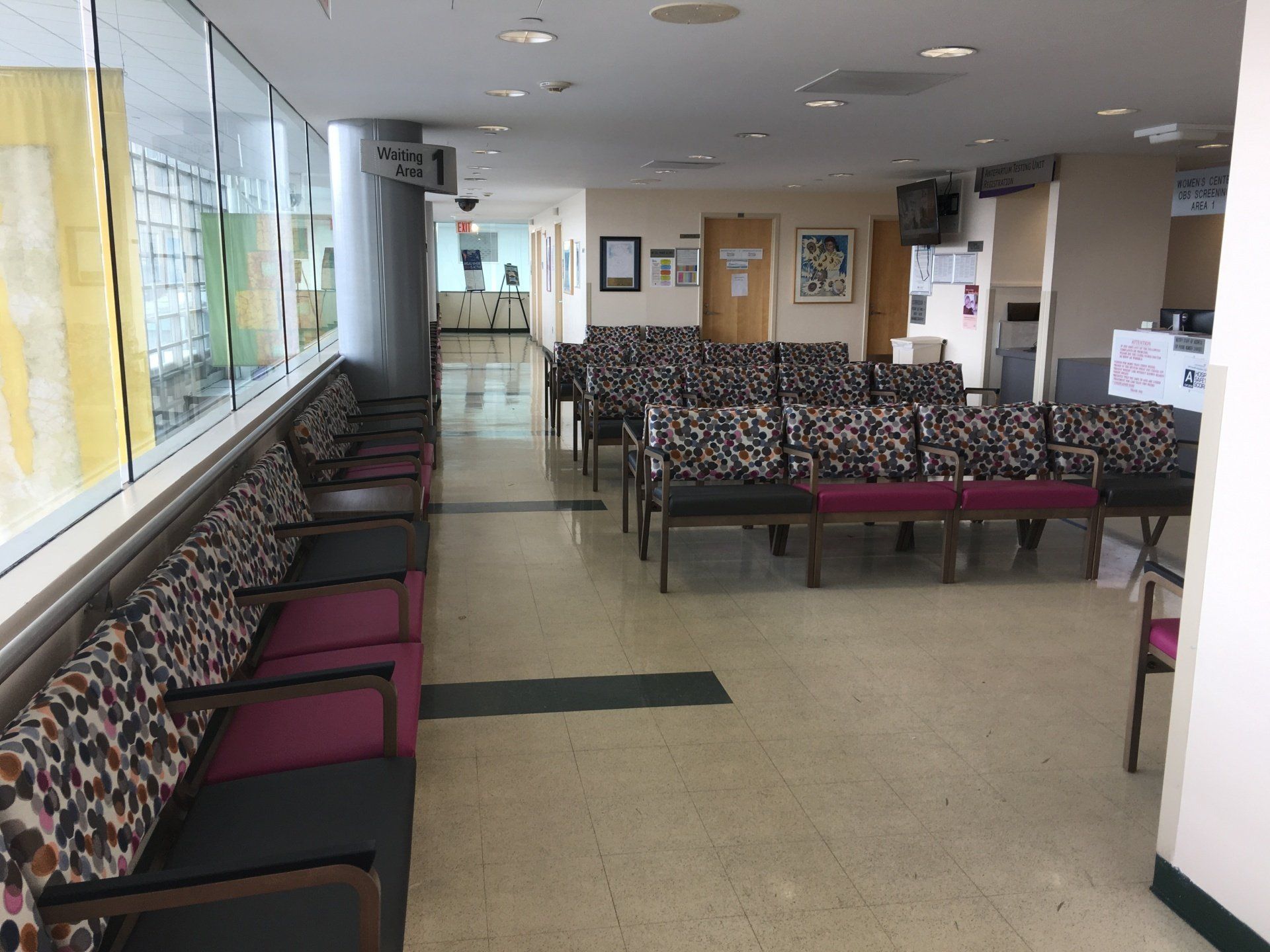 A hospital waiting room with a lot of chairs