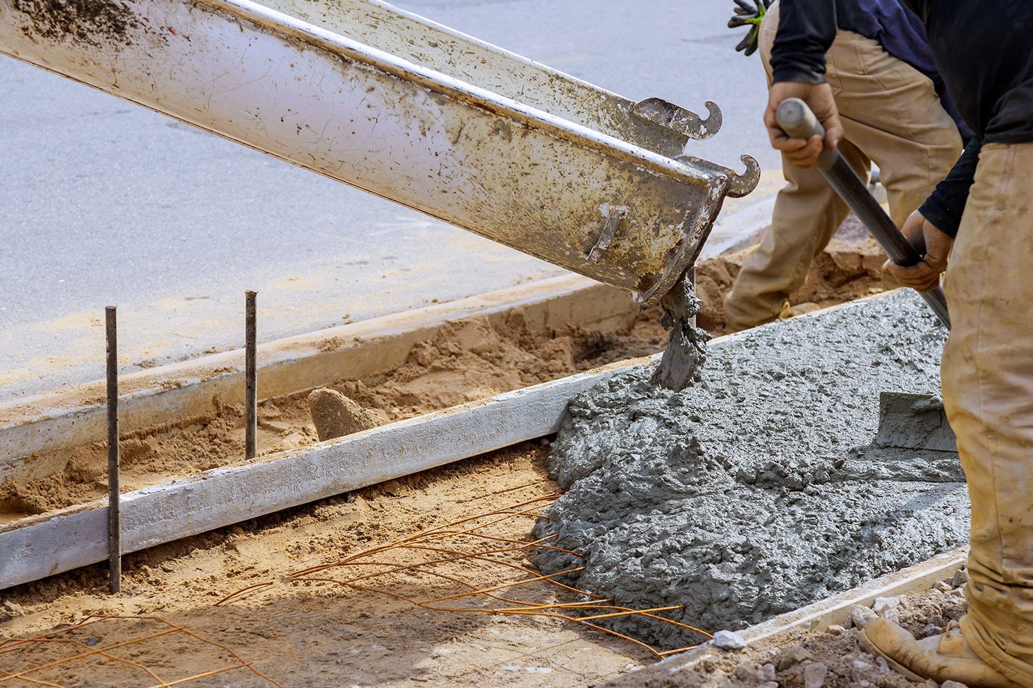 A truck is pouring ready-mix concrete.
