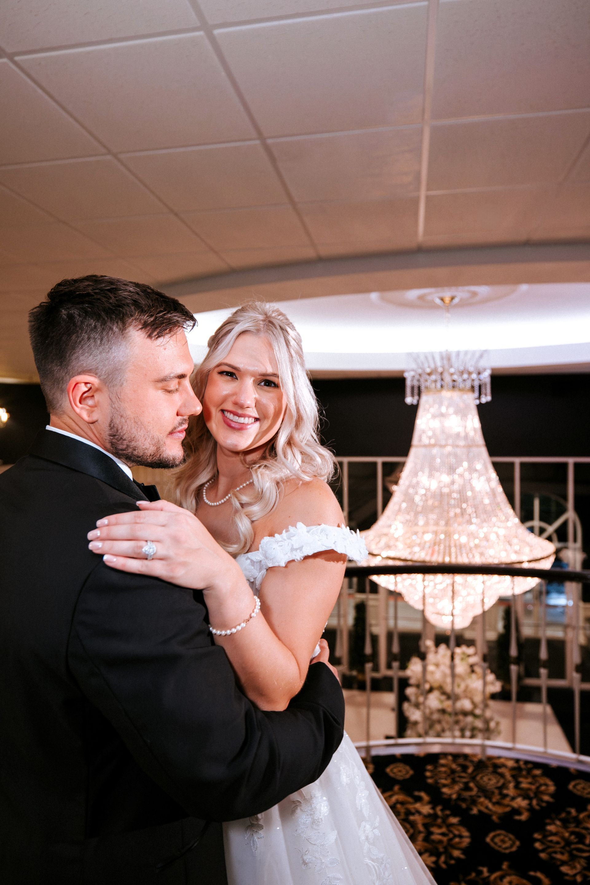 Bride and Groom with chandelier 