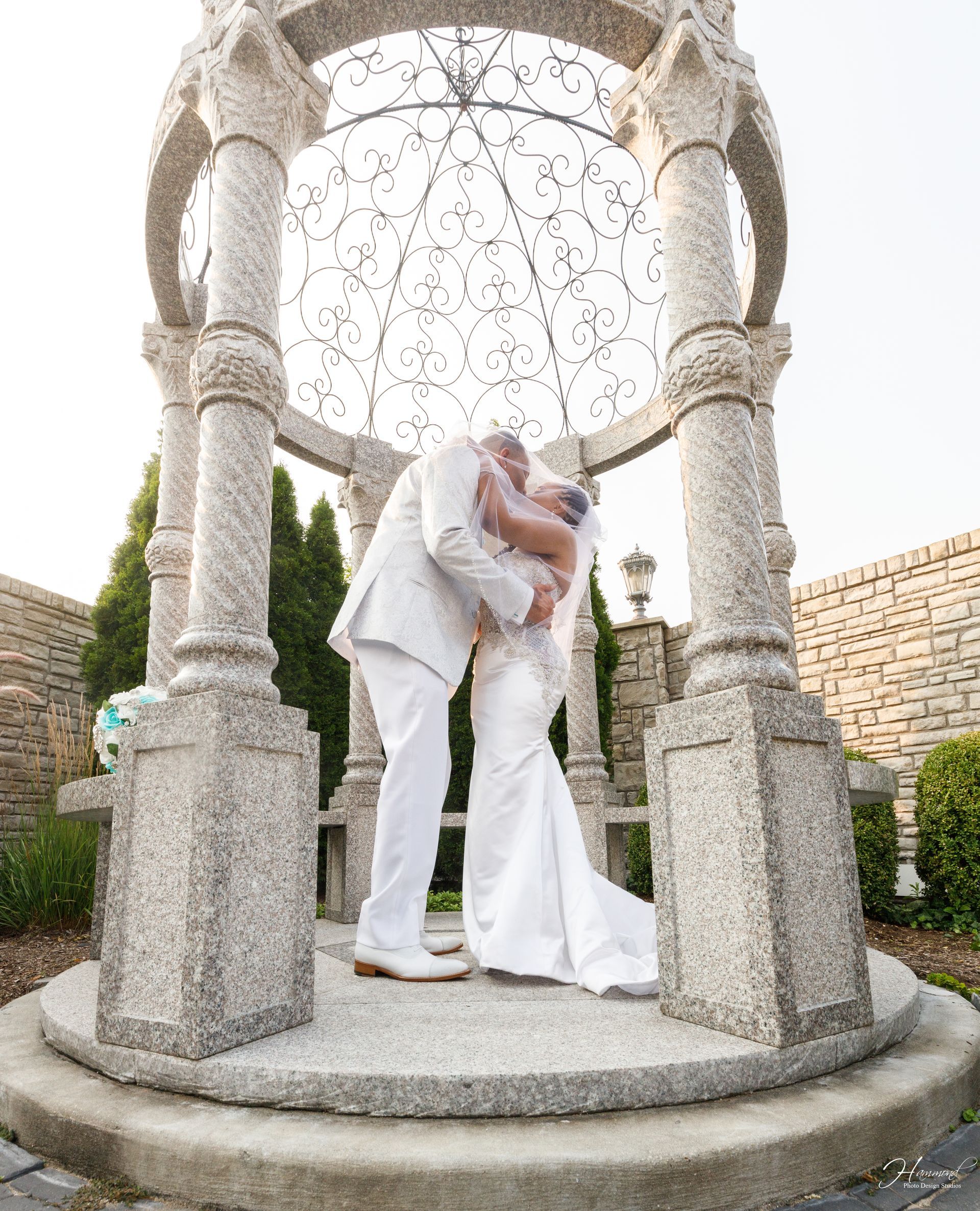 Bride and groom in gazebo 