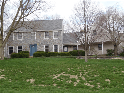Two level grey  home with new windows in State College, PA
