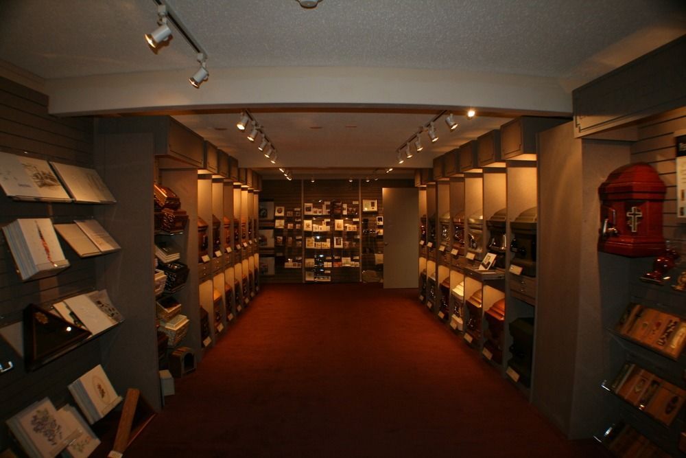 Bookstore aisle with shelves of books on both sides and a red carpeted floor