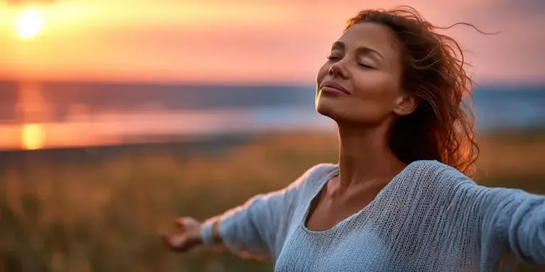 Columbus Woman taking in a deep breath of fresh air on beach thanks to Hypnotherapy she quit smoking