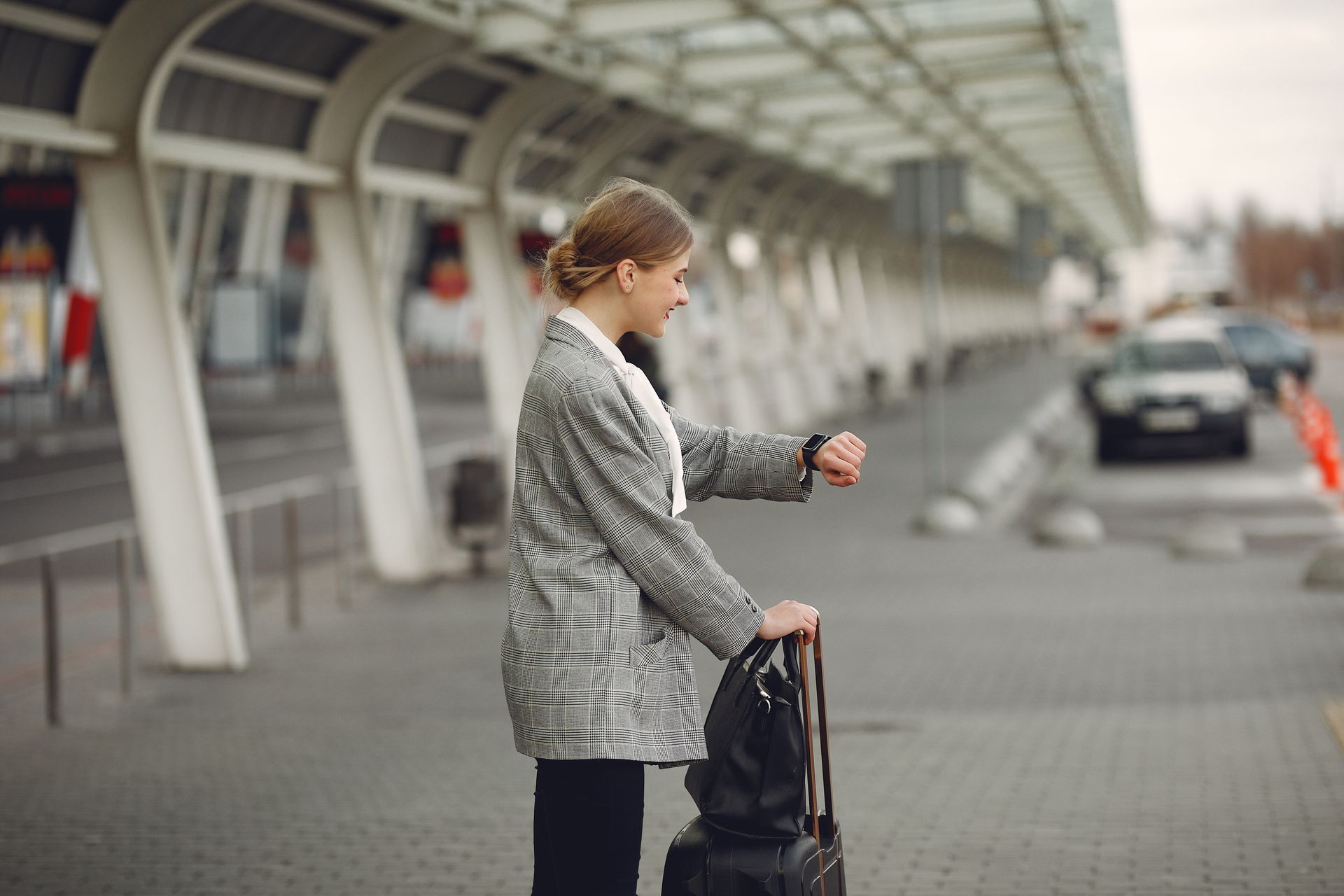 Professional assistance and private transfer service for a business traveler waiting at the airport gate in Portugal or Spain.