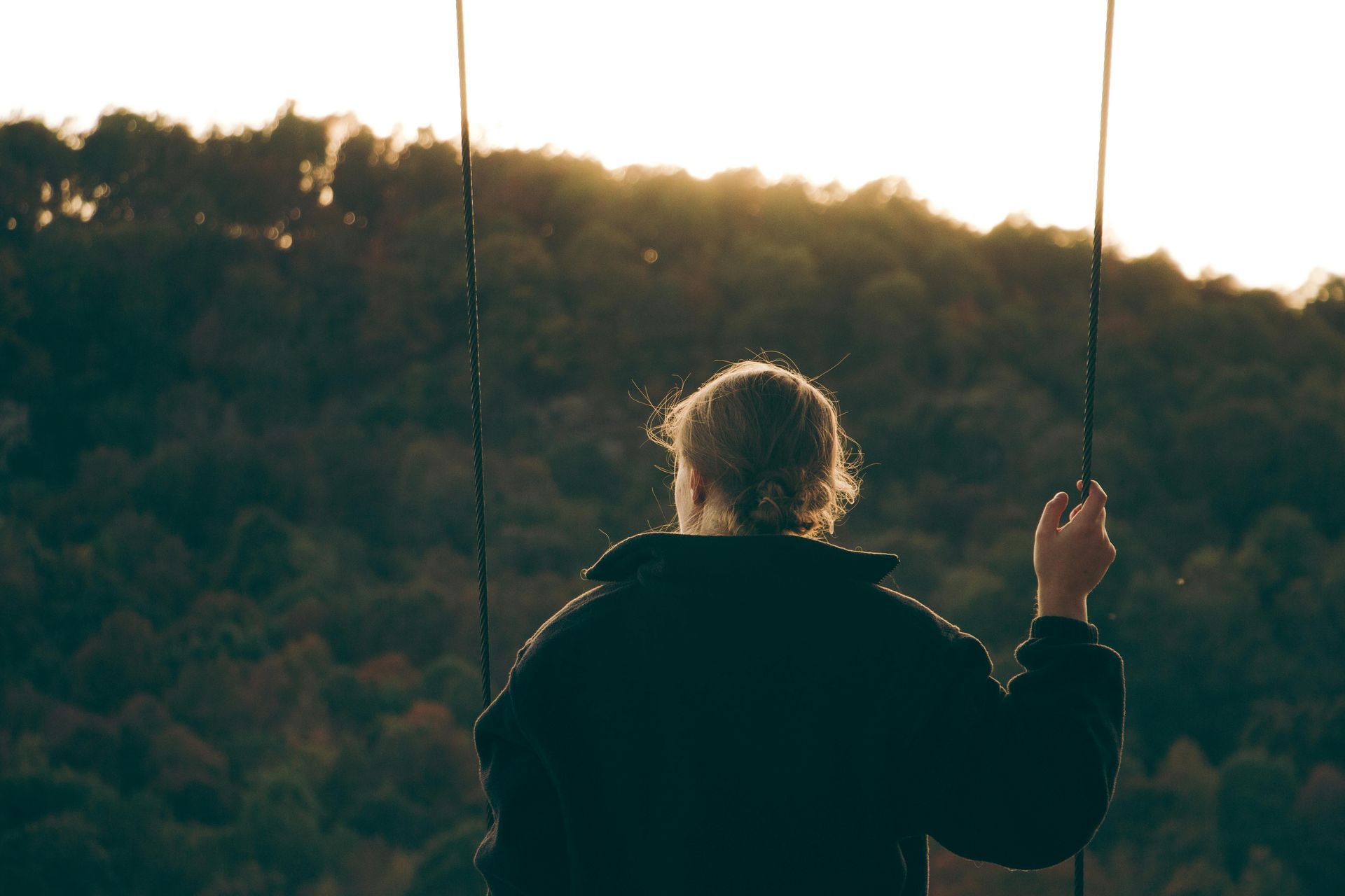 person looking at sunset over lush hill in Paragould arkansas