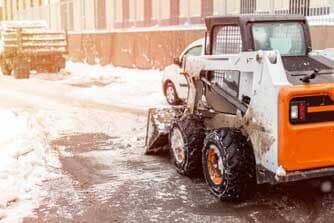 Machine remove snow from a city street — Snow removal in Denver, CO