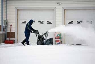 Man operating a snow blower — Snow removal in Denver, CO