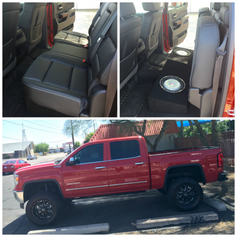 Red pickup truck with customized rear-seat and storage setup, shown inside and parked outdoors.