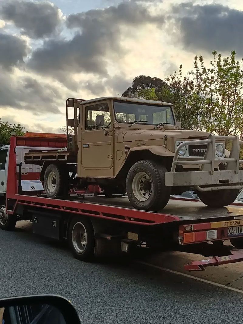 A Jeep Is Sitting On Top Of A Tow Truck - All Recovery Towing & Transport in Richardson ACT