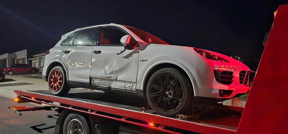 Damaged Luxury Car On A Tow Truck - All Recovery Towing & Transport in Richardson ACT