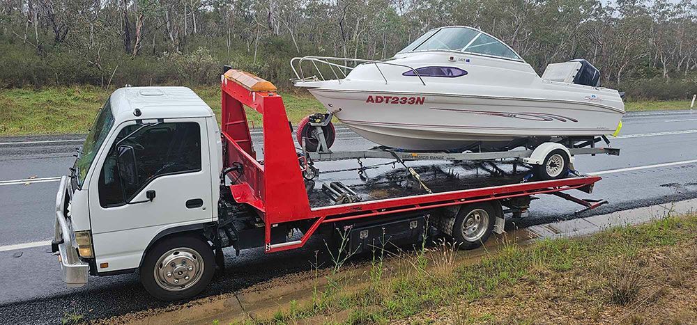 Boat On A Tow Truck - All Recovery Towing & Transport in Richardson ACT