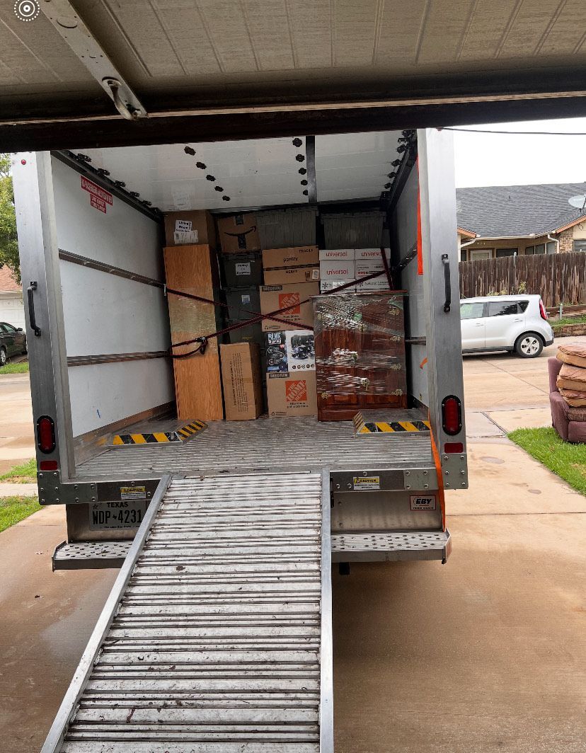 A man is fixing a sink in a kitchen.