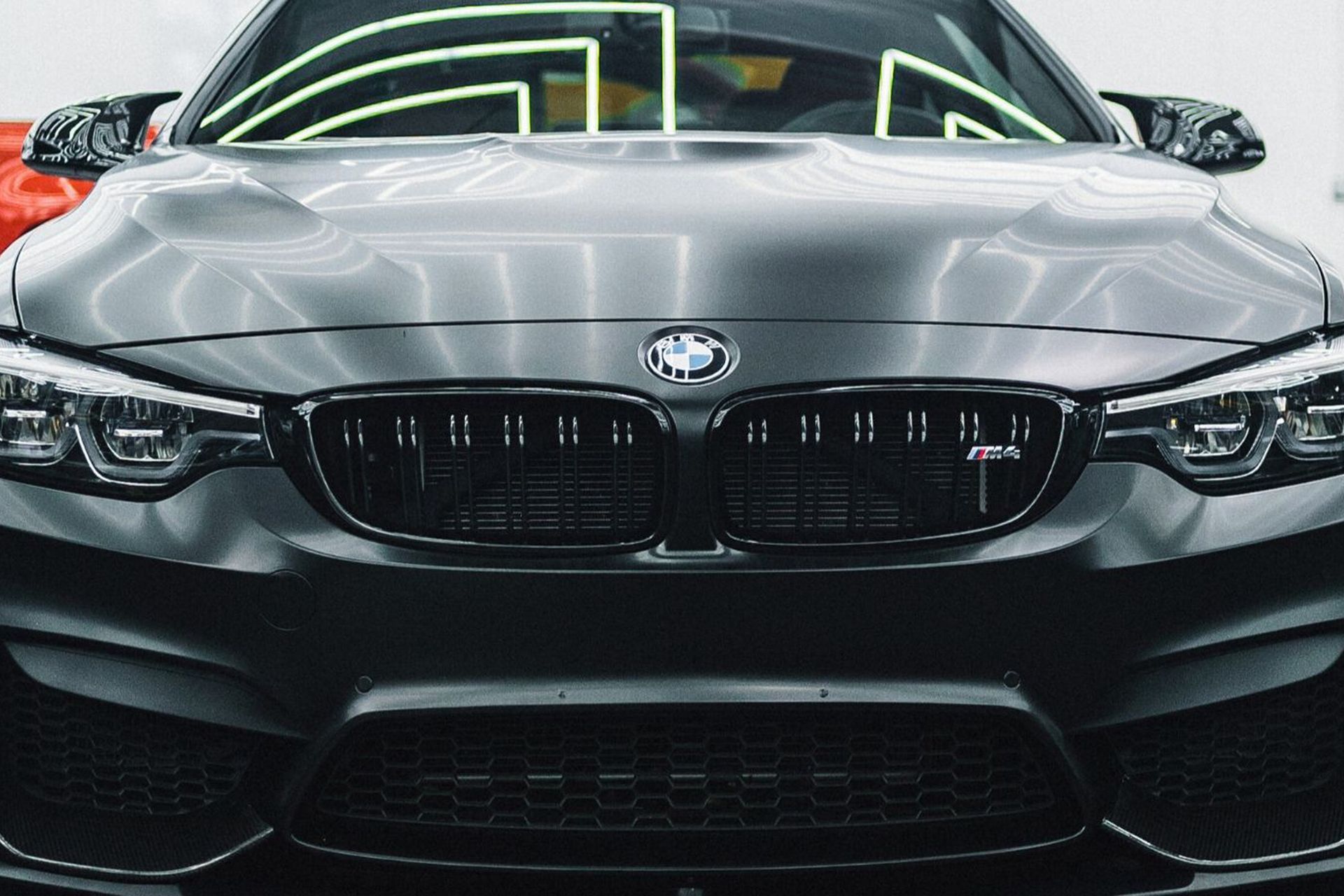 A close up of the front of a bmw m4