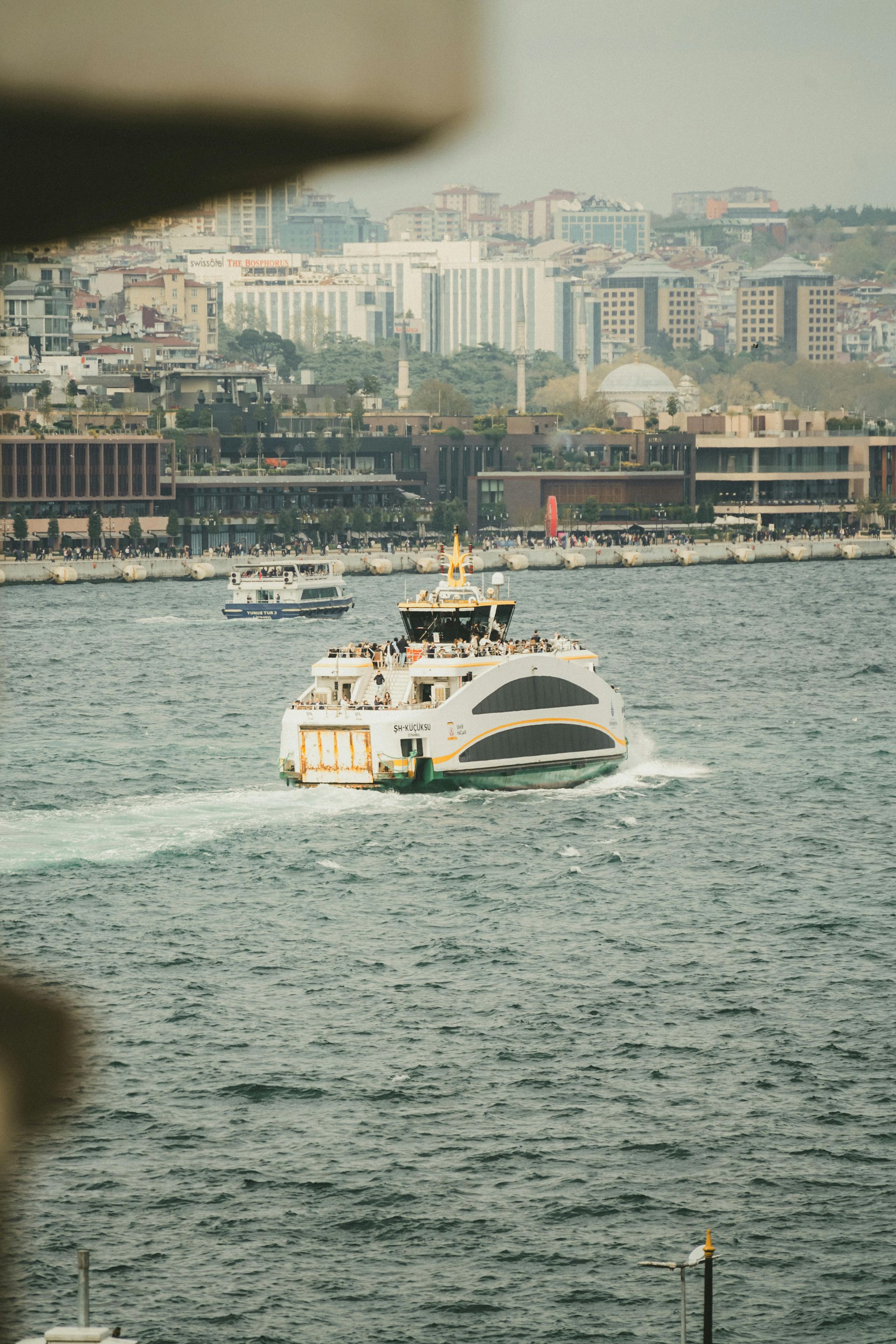 A boat is floating on top of a body of water.