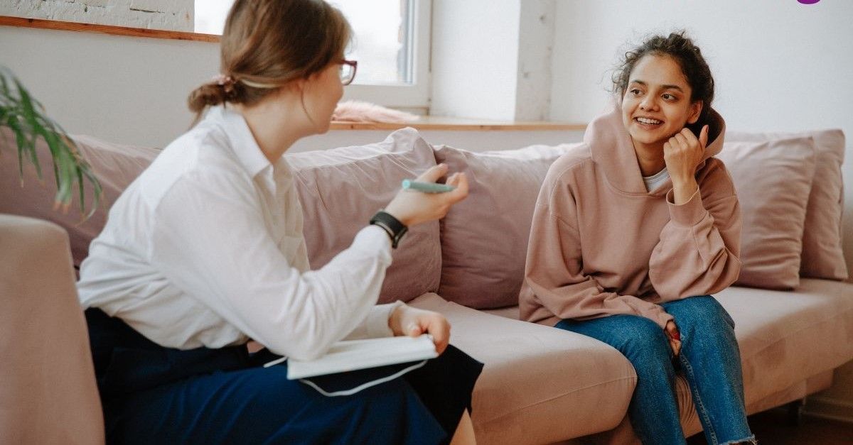 Stock image of young person in counselling session with therapist
