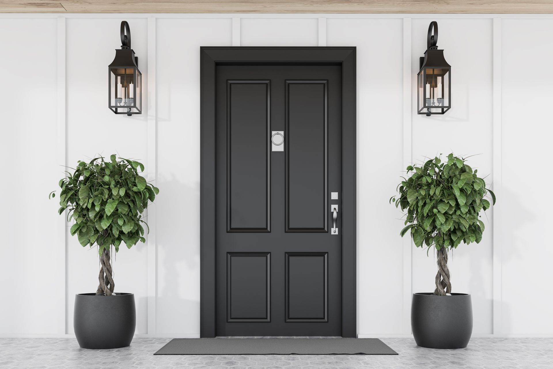 a black door with two potted plants in front of it .