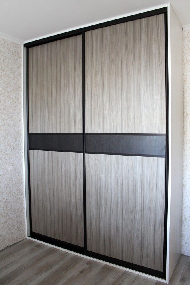 A Sliding Door Wardrobe With a Black Trim in a Bedroom — Whitsunday Screens & Grilles In Proserpine, QLD
