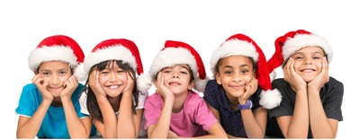 Five children in Santa hats lie in a row against a white background, smiling with their hands resting under their chins.
