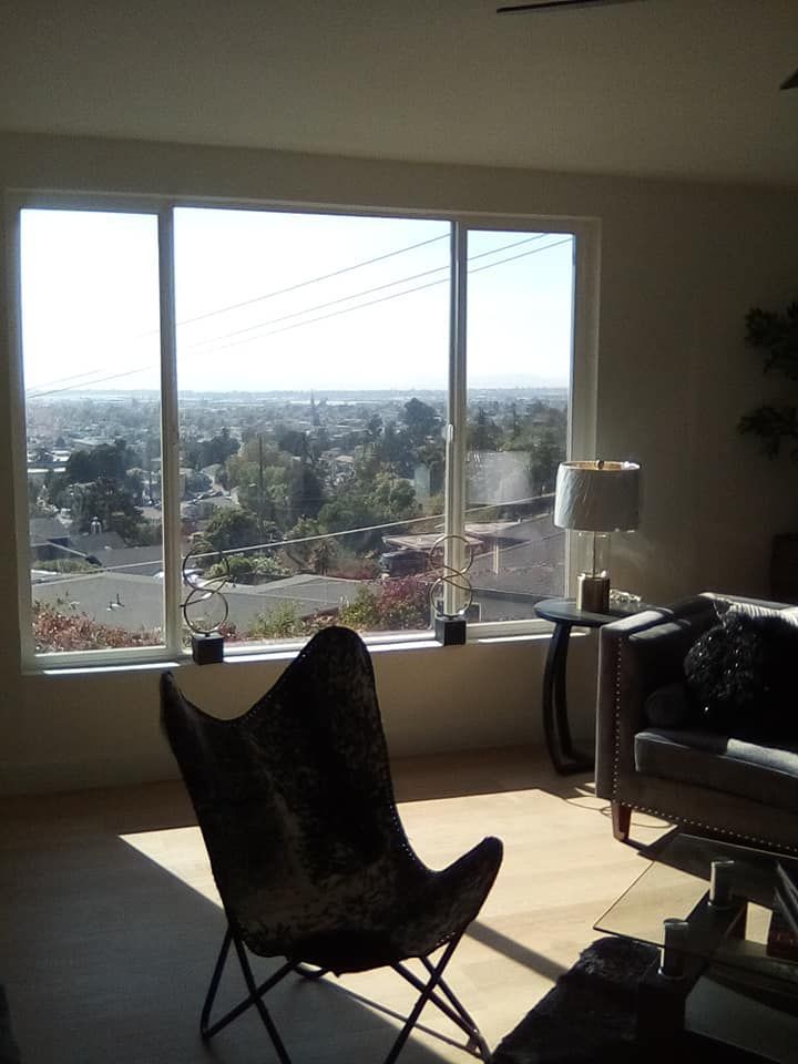 A bedroom with green walls and a large bed.