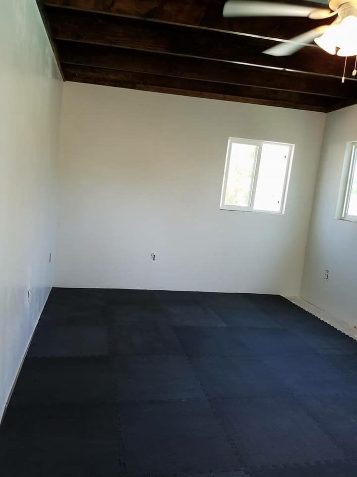 A close up of a wooden floor in an empty room.