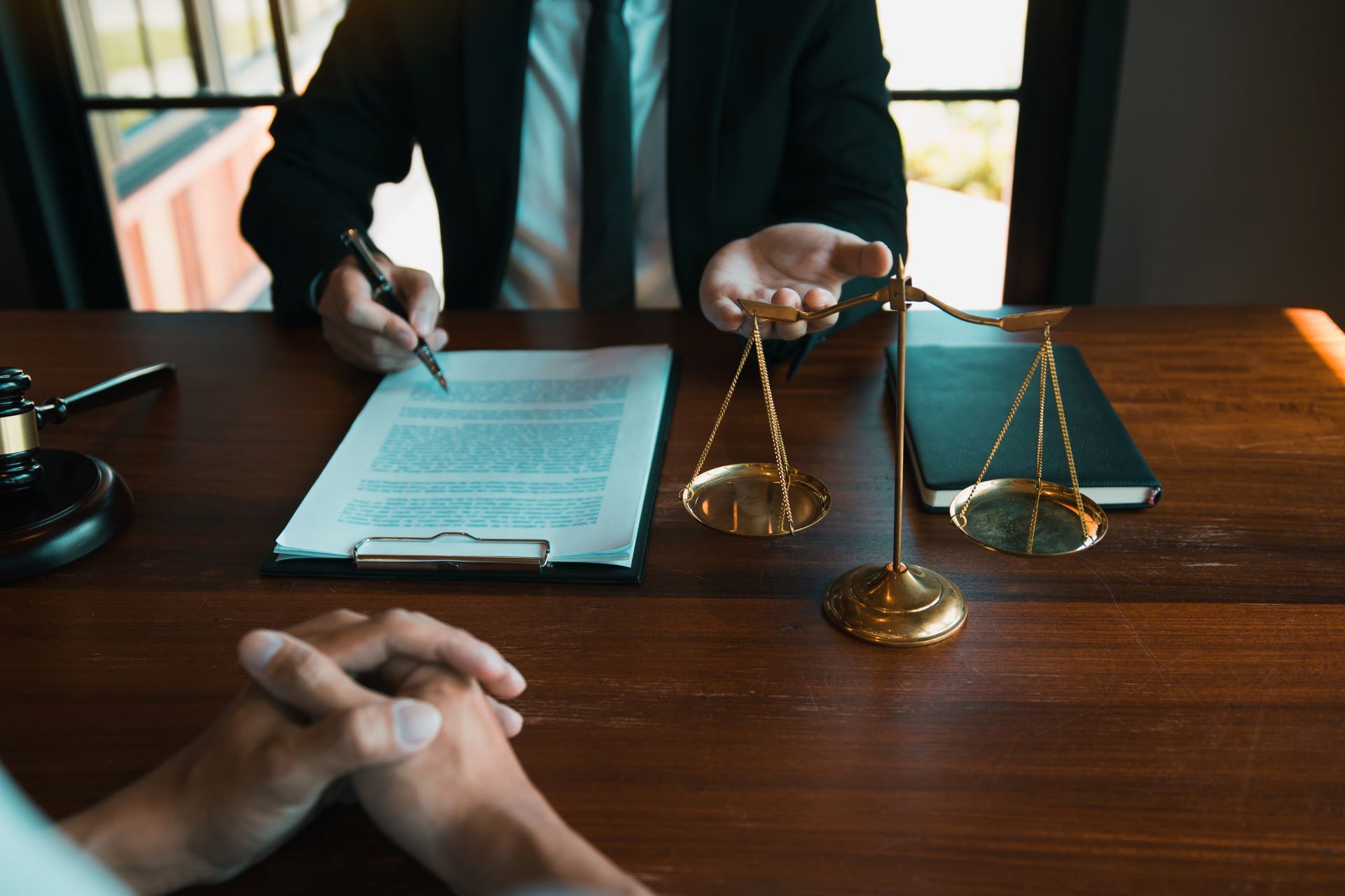 lawyer with client at desk