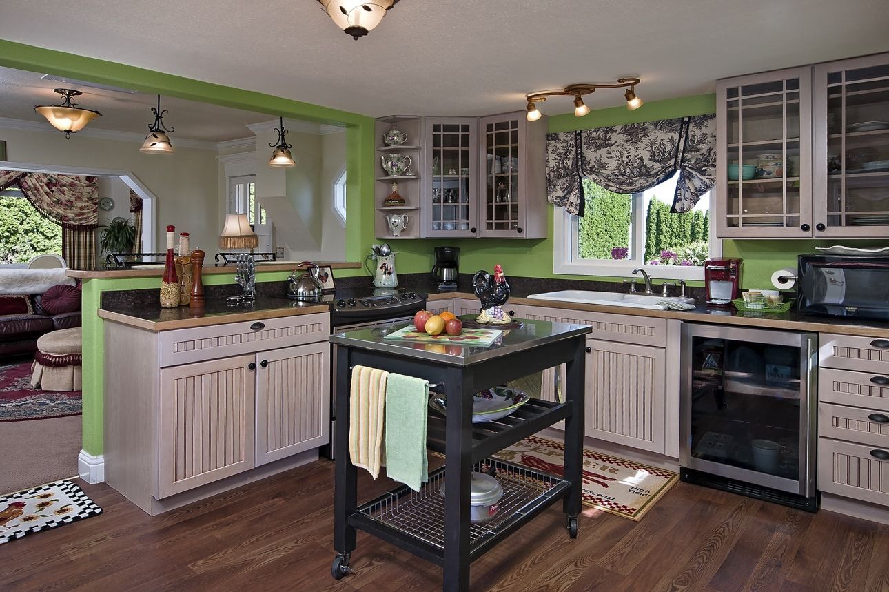 A kitchen with a large island in the middle of it