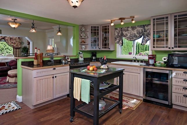 A kitchen with a large island in the middle of it.