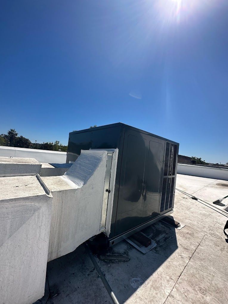 A large black box is sitting on top of a roof.