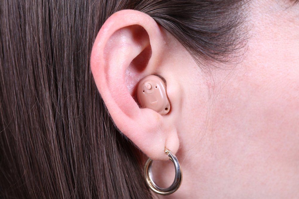 Woman Wearing Modern Hearing Aid — Belfast, ME — Hearing Solutions