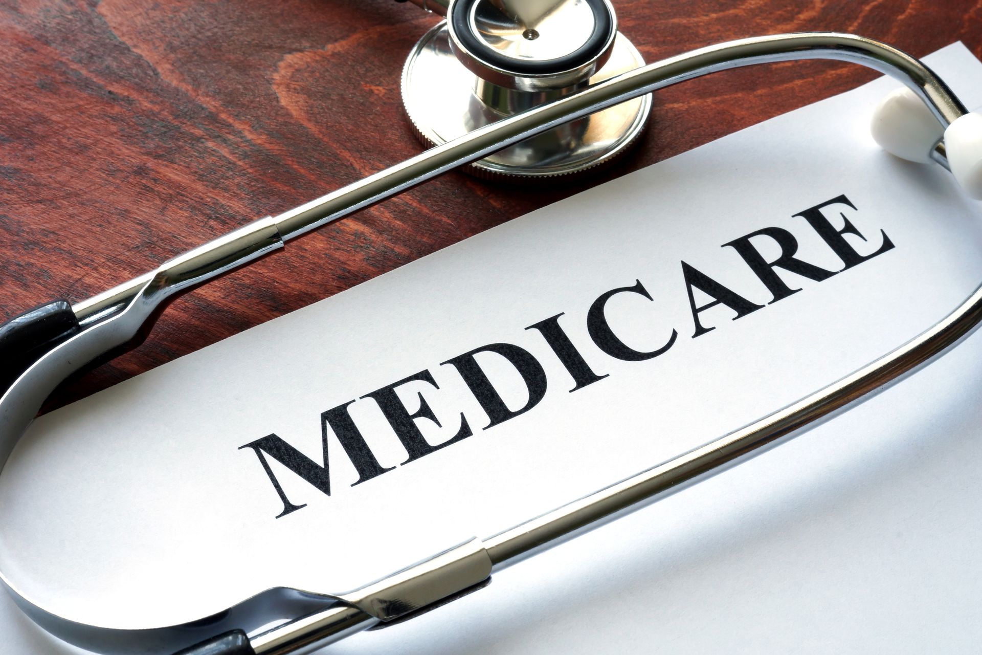 Stethoscope and a paper with the word medicare.