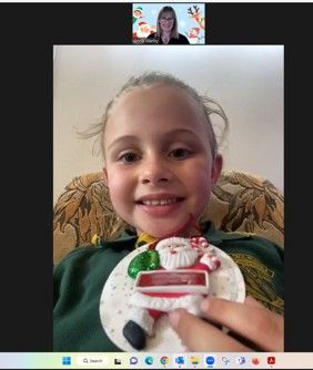 Kid Holding A Letter Cardboard — Speech Pathologist in Toowoomba, QLD