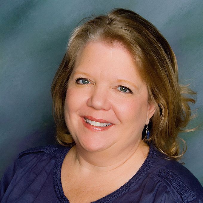 A woman in a blue shirt is smiling for the camera. - New Albany, Indiana, Timmel Law Office