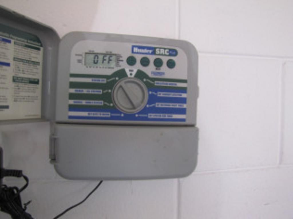 A sprinkler controller with the word off on it