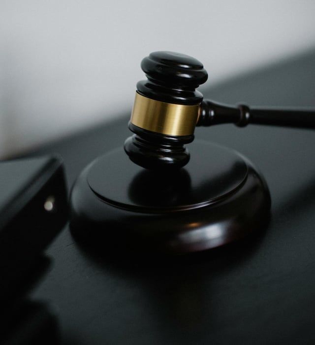 A close up of a judge 's gavel on a table