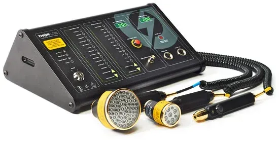 A black medical laser therapy control console with a yellow digital display and three interchangeable light probe tips.