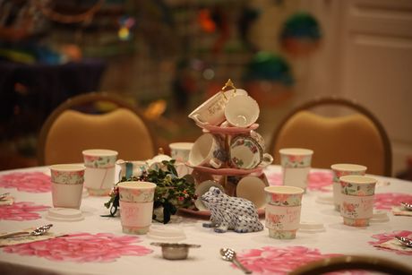 A table set for a tea party with cups and saucers on it. Southrn Dining