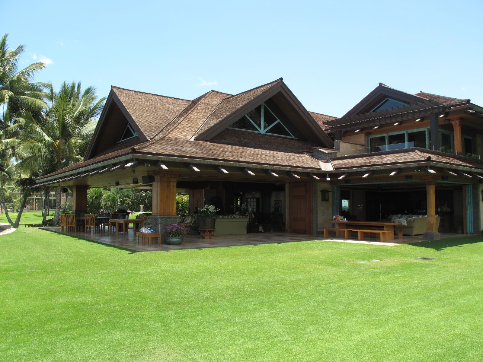 A large house with a large lawn in front of it
