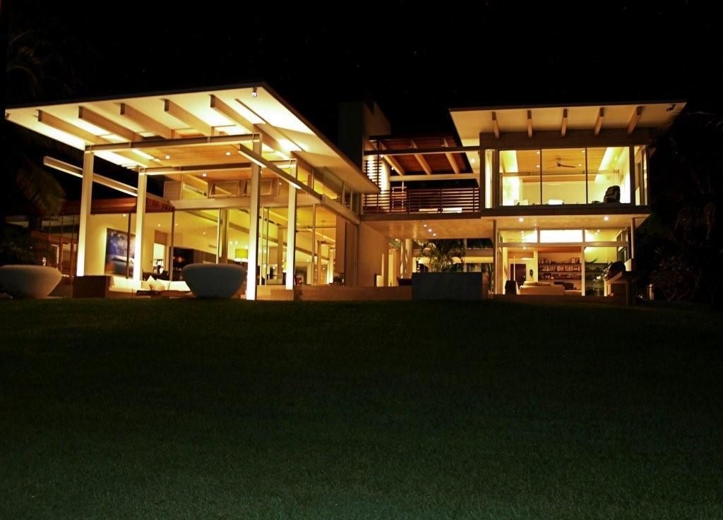 The Makena Modern residence in Maui, HI  lit up at night