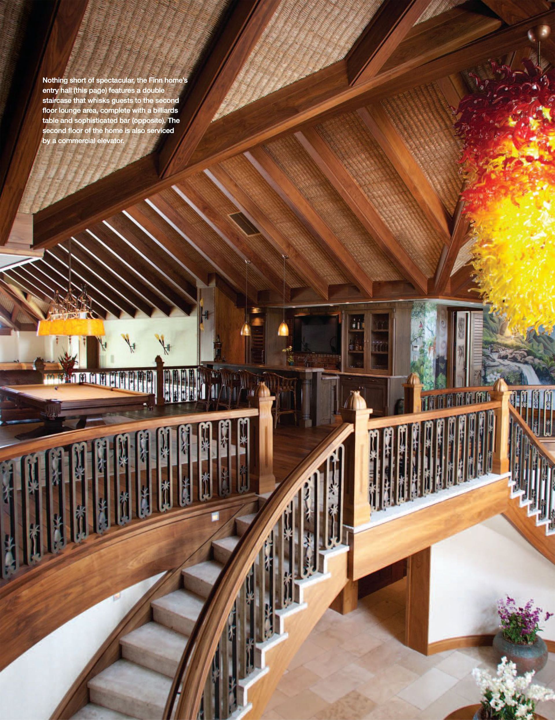 A wooden staircase leading up to the second floor of the Makena Waterfront Estate featured in Gentry Home Magazine.