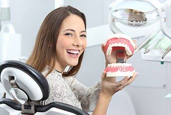 Patient holding model of teeth - Preventive care in Chesnee, SC
