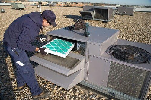 Inspecting roof top unit, Air Conditioning and Heating Systems in Ocean, NJ