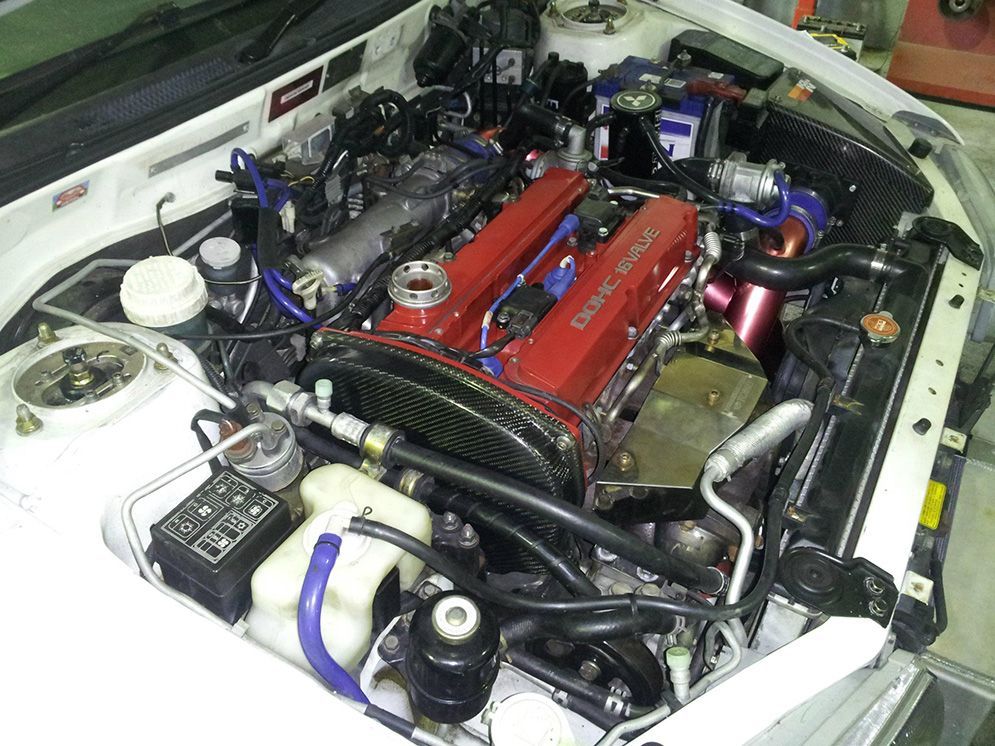 The Engine of a White Car With the Hood Open — Northern Service Centre in Edmonton, QLD