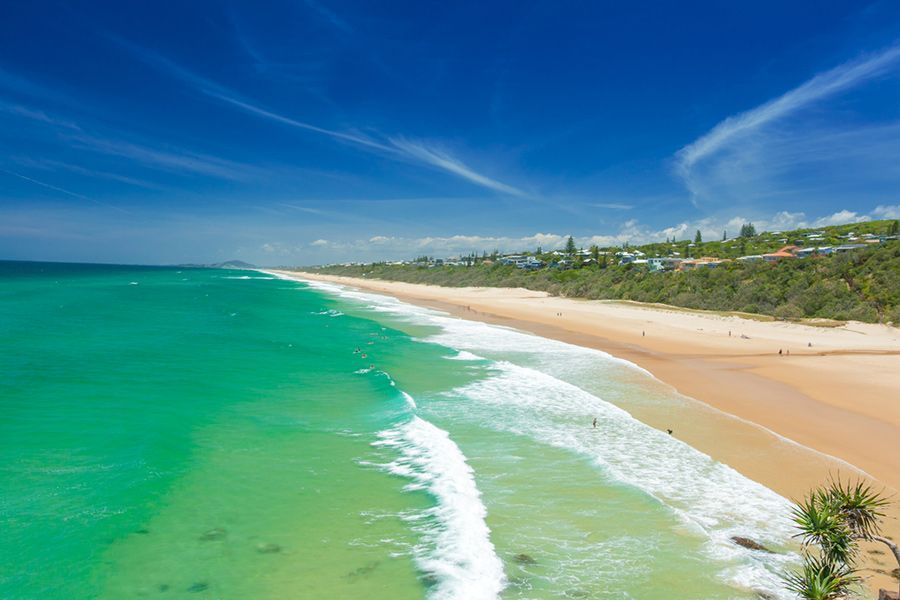 A View of A Beach with Waves Crashing on The Shore on A Sunny Day — Start Learning Automotive in Sunshine Coast, QLD