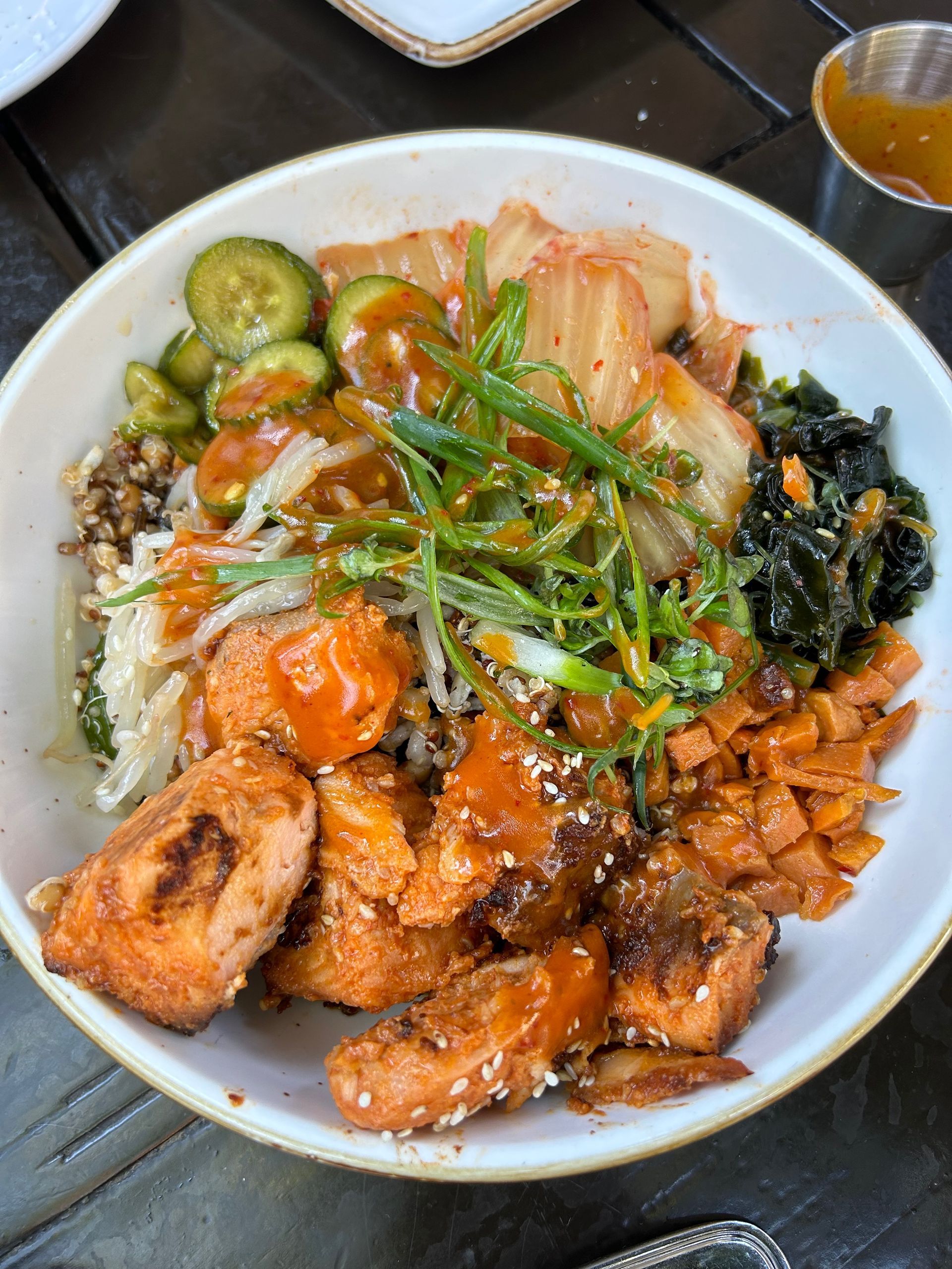 A close up of a bowl of food on a table.