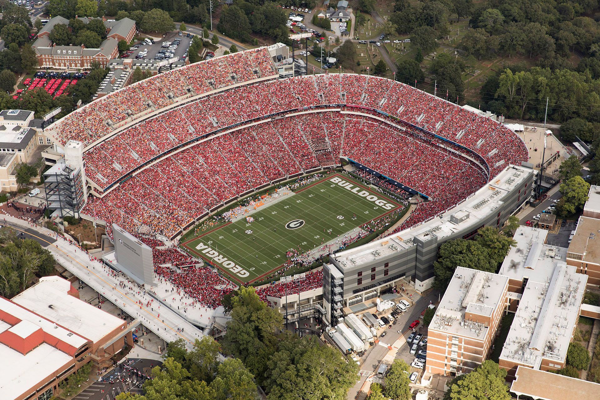 An aerial view of a football stadium with the word carolina on the field